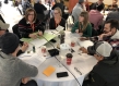 People sit around a table for discussion